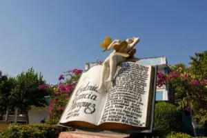 ARACATACA, COLOMBIA - FEBRUARY 1, 2024: Monument in honor of Gabriel Garcia Marquez and his book One Hundred Years of Solitude that has a fragment of the book and Remedios la Bella